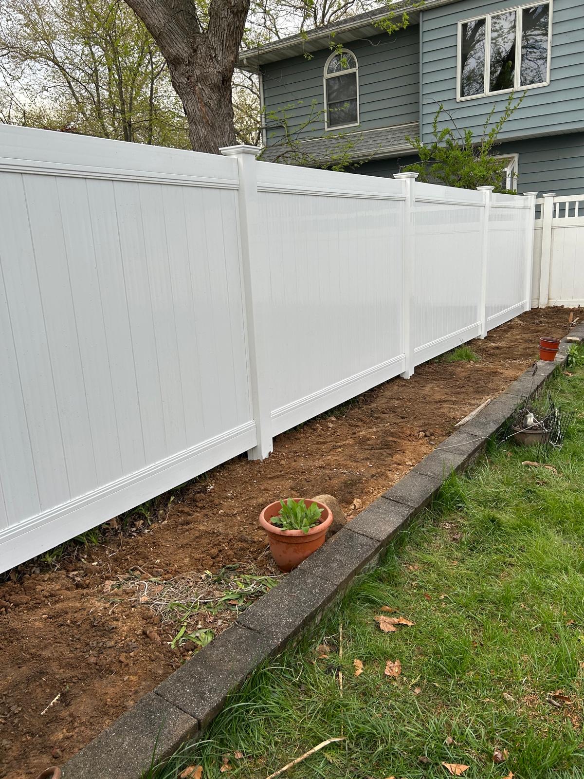 Vinyl fence and garden bed